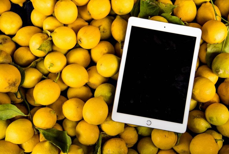 An iPad on tangerines - Darren Yaw Foo Hoe